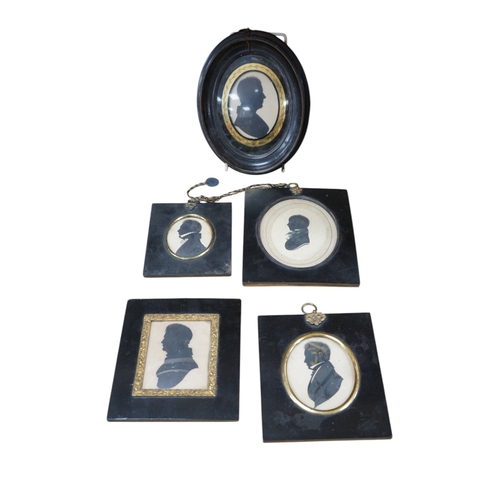 512 - A family group of five 19th century silhouettes in ebony frames, largest 9cm high. Condition - fair... 