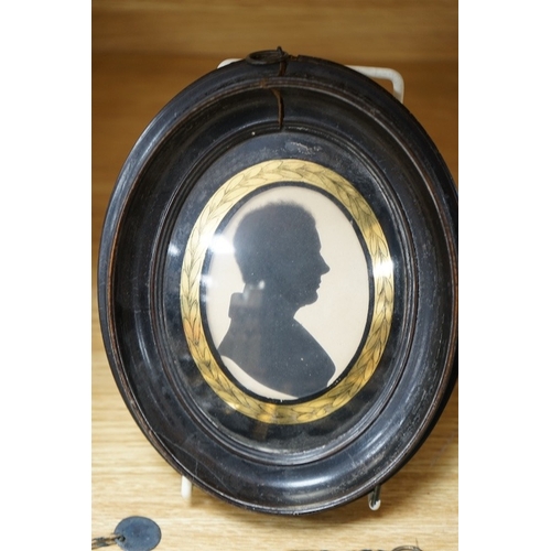 512 - A family group of five 19th century silhouettes in ebony frames, largest 9cm high. Condition - fair... 