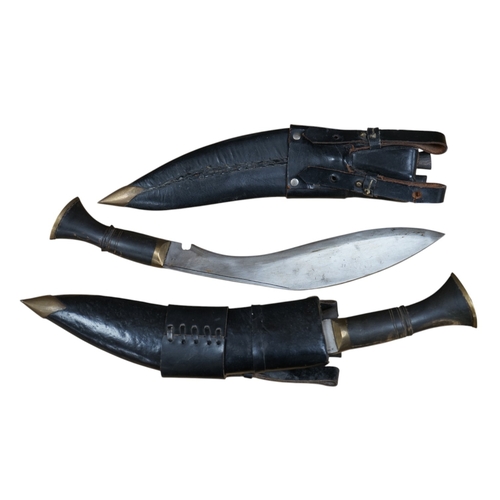 514 - Two leather cased kukri, 43cm long. Condition - good