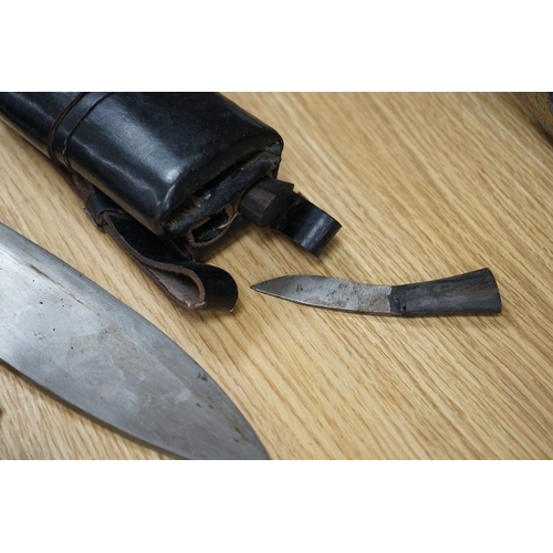 514 - Two leather cased kukri, 43cm long. Condition - good