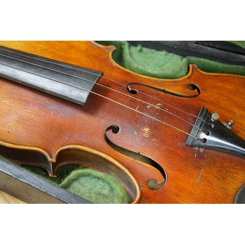 518 - A 19th century cased violin and bow, body of violin 35.5cm long. Condition - needs restringing... 