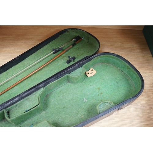 518 - A 19th century cased violin and bow, body of violin 35.5cm long. Condition - needs restringing... 