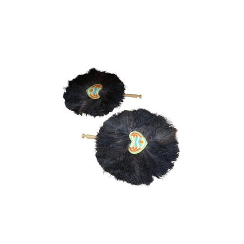 519 - A pair of ostrich feather fans, with embroidered central panels, 45cm high. Condition - good