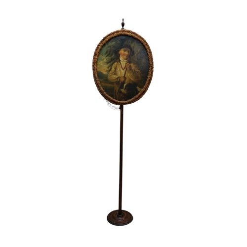 524 - An oval Regency fire screen painting of a shepherd boy with his dog and a painting verso of ephemera... 