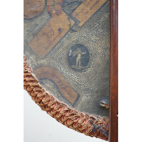 524 - An oval Regency fire screen painting of a shepherd boy with his dog and a painting verso of ephemera... 