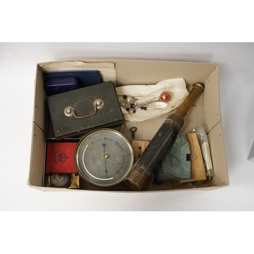 537 - A Victorian brass four draw telescope, a drum cased aneroid barometer, coins and paper money, first ... 