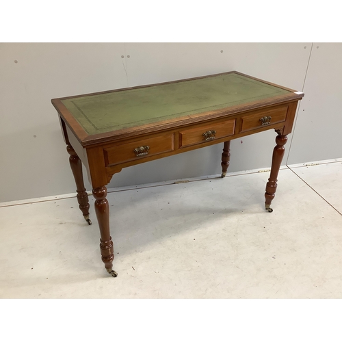 54 - A late Victorian mahogany three drawer writing table, with an inset leather top, width 113cm, depth ... 