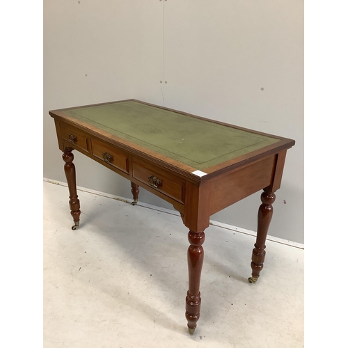 54 - A late Victorian mahogany three drawer writing table, with an inset leather top, width 113cm, depth ... 