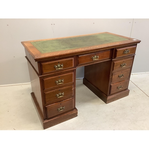 60 - A late Victorian mahogany kneehole pedestal desk, fitted nine small drawers, width 121cm, depth 59cm... 