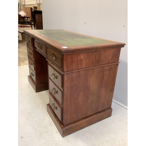 60 - A late Victorian mahogany kneehole pedestal desk, fitted nine small drawers, width 121cm, depth 59cm... 