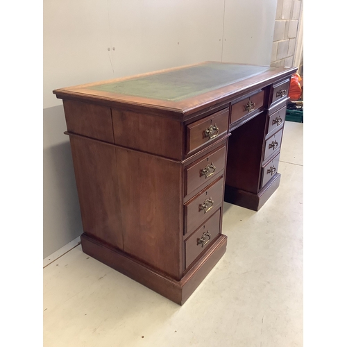 60 - A late Victorian mahogany kneehole pedestal desk, fitted nine small drawers, width 121cm, depth 59cm... 