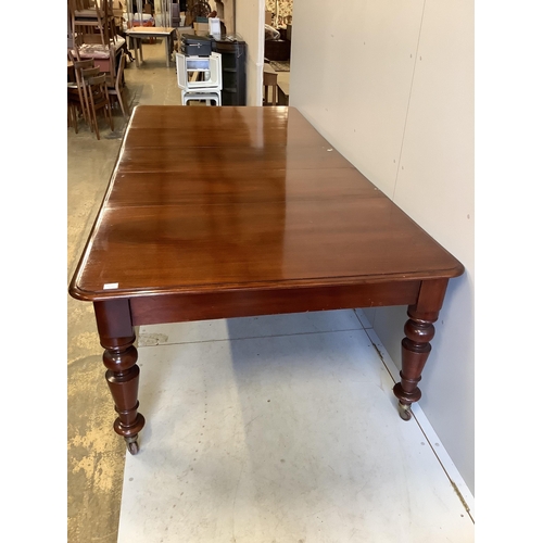 62 - A Victorian rectangular mahogany extending dining table, 280cm extended, three spare leaves, depth 1... 