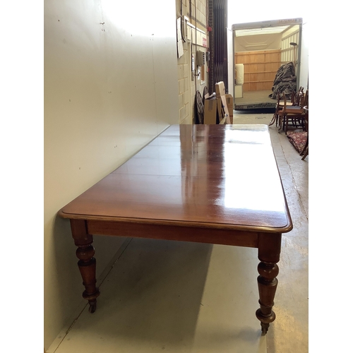 62 - A Victorian rectangular mahogany extending dining table, 280cm extended, three spare leaves, depth 1... 