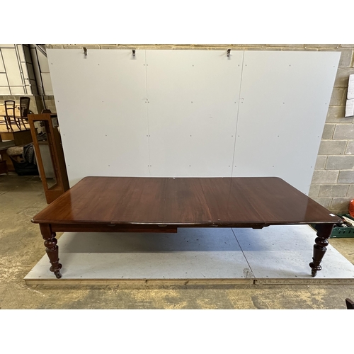 62 - A Victorian rectangular mahogany extending dining table, 280cm extended, three spare leaves, depth 1... 