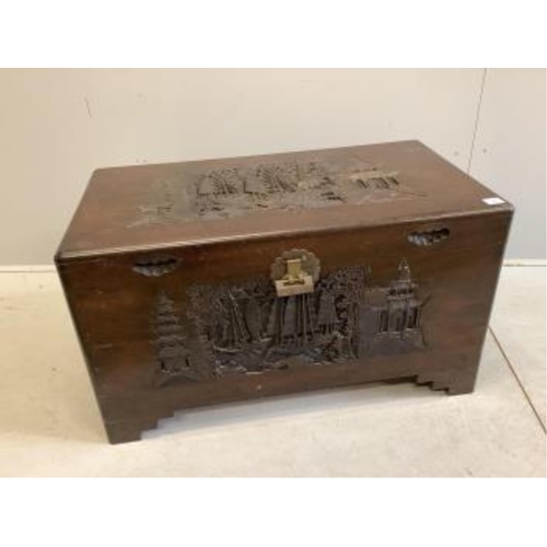 65 - A Chinese carved camphorwood trunk, width 100cm, depth 55cm, height 57cm. Condition - fair