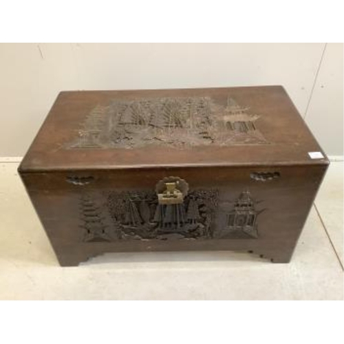 65 - A Chinese carved camphorwood trunk, width 100cm, depth 55cm, height 57cm. Condition - fair