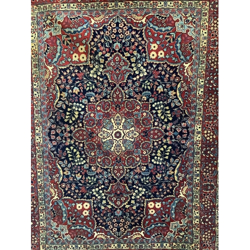 69 - A Sarouk Feraghan Persian blue ground rug, 186 x 137cm. Condition - good