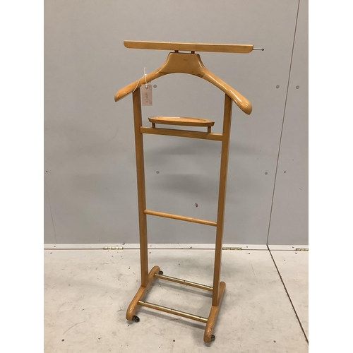 7 - A folio stand, height 82cm together with a travelling Windsor & Newton easel and a dumb waiter. Cond... 