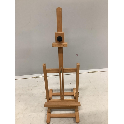 7 - A folio stand, height 82cm together with a travelling Windsor & Newton easel and a dumb waiter. Cond... 