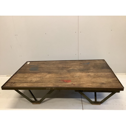 73 - An Industrial style cast iron and planked oak coffee table converted from a Second War British milit... 