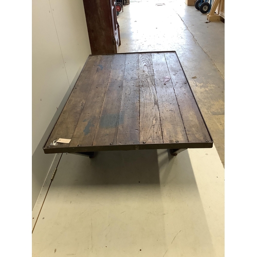 73 - An Industrial style cast iron and planked oak coffee table converted from a Second War British milit... 