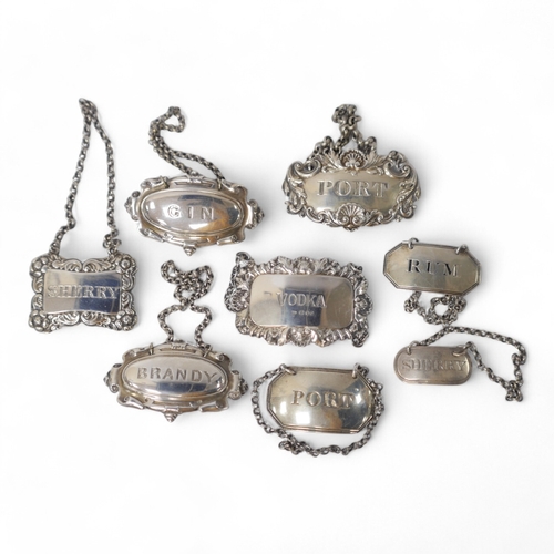 836 - A collection of eight George III and later silver wine labels, including octagonal Port by Thomas Ol... 