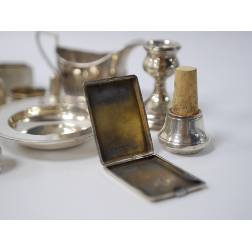 838 - Small silver including two cream jugs, one demi-fluted, Birmingham, 1894, a dish, a dwarf candlestic... 