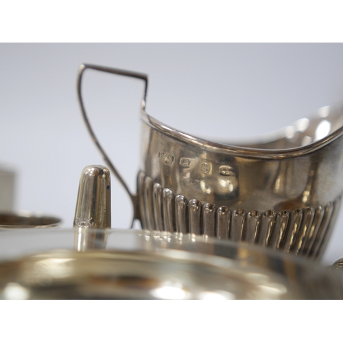 838 - Small silver including two cream jugs, one demi-fluted, Birmingham, 1894, a dish, a dwarf candlestic... 