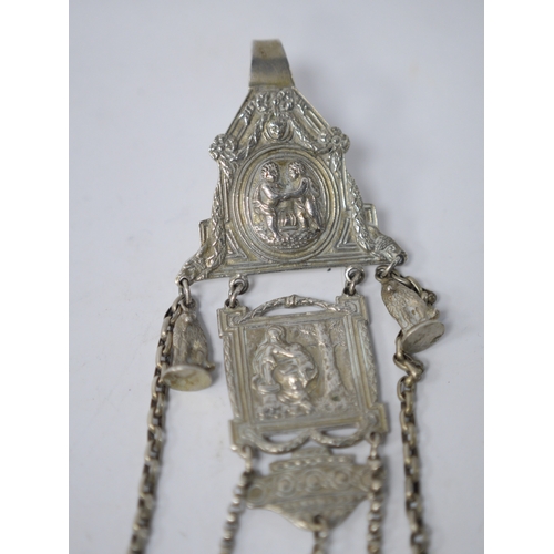 844 - A late 19th/early 20th century continental white metal chatelaine, hung with six assorted accoutreme... 