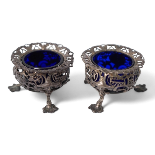 845 - A pair of early Victorian pierced silver circular salts, with mask knees and scroll pad feet, John W... 