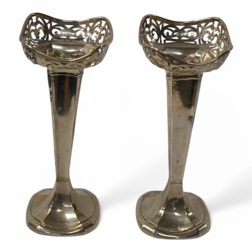 846 - A pair of George V silver spill vases, by H.L. Brown & Sons, 22.5cm, weighted. Condition - poor... 