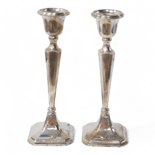 849 - A pair of George V silver candlesticks, Birmingham, 1921, 19.9cm, weighted. Condition - poor