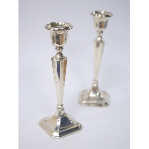 849 - A pair of George V silver candlesticks, Birmingham, 1921, 19.9cm, weighted. Condition - poor