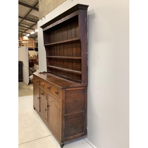 85 - A George III oak dresser with boarded rack, width 168cm, depth 46cm, height 204cm. Condition - poor,... 