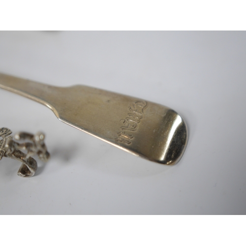 853 - A late 19th century continental silver caddy spoon, with figural terminal, import marks for Sheffiel... 