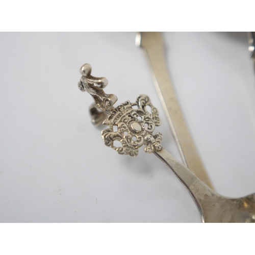 853 - A late 19th century continental silver caddy spoon, with figural terminal, import marks for Sheffiel... 