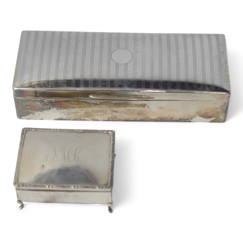 856 - A George V silver mounted rectangular cigarette box, London, 1926, 25.9cm, together with an Edwardia... 