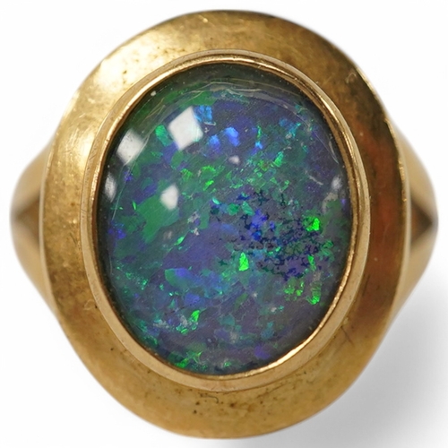 902 - A modern Italian 18k and opal doublet set ring, size N/O, gross weight 4.9 grams. Condition - fair t... 