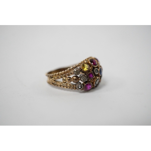 903 - A 1940's continental yellow metal and multi gem set cluster dress ring, size P, gross weight 6.6 gra... 