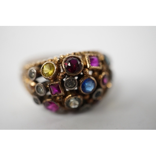 903 - A 1940's continental yellow metal and multi gem set cluster dress ring, size P, gross weight 6.6 gra... 