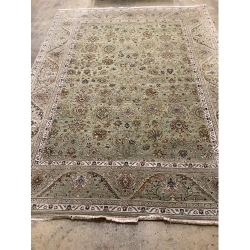 91 - A North West Persian pale green ground carpet, approx. 380 x 280cm. Condition - good