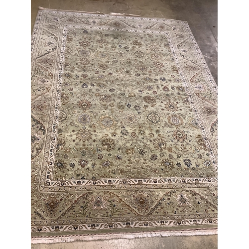 91 - A North West Persian pale green ground carpet, approx. 380 x 280cm. Condition - good