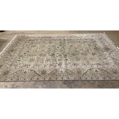 91 - A North West Persian pale green ground carpet, approx. 380 x 280cm. Condition - good