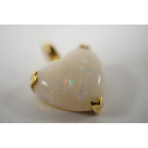 914 - A modern 18ct gold mounted heart shaped white opal pendant, overall 20mm, gross weight 3.2 grams. Co... 