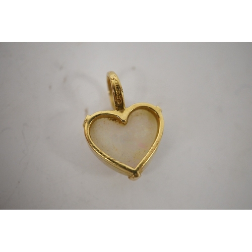 914 - A modern 18ct gold mounted heart shaped white opal pendant, overall 20mm, gross weight 3.2 grams. Co... 