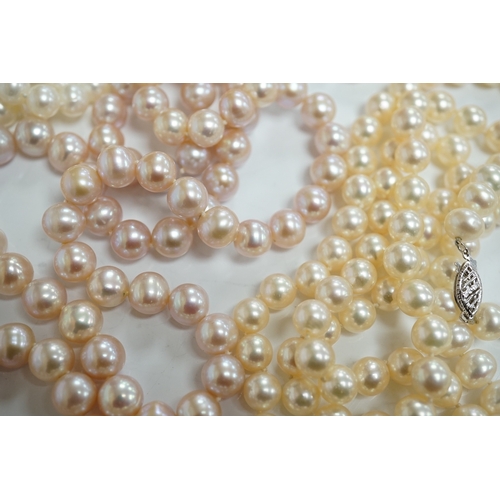 920 - Six assorted modern single strand cultured pearl necklaces, one with 14k clasp, longest 86cm, a pair... 