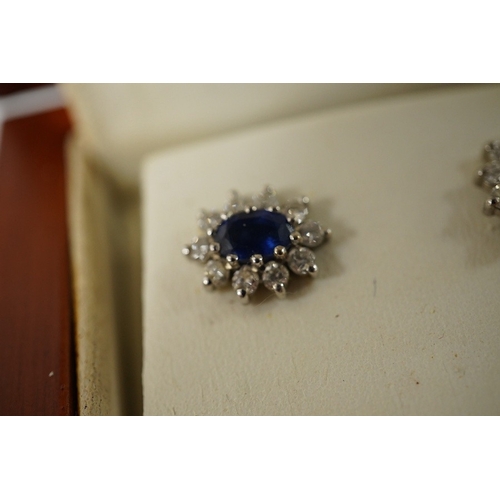 935 - A pair of sapphire and diamond cluster earrings, length 2.2cm each, post fittings, and a gold, garne... 