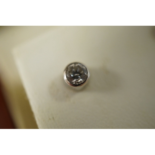 936 - A pair of diamond ear studs, each collet-set with a brilliant-cut diamond weighing approximately 0.2... 