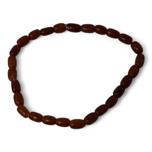 937 - A single strand amber bead necklace, 34cm, gross weight 20 grams. Condition - poor to fair