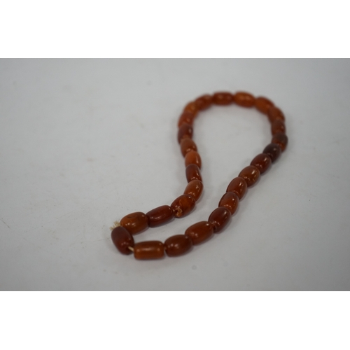 937 - A single strand amber bead necklace, 34cm, gross weight 20 grams. Condition - poor to fair